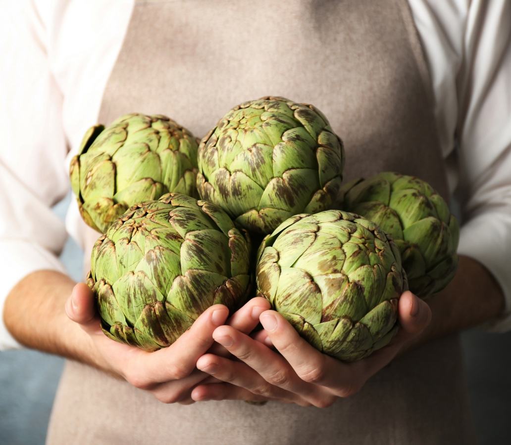 holding artichokes