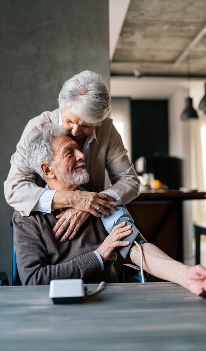 Senior couple measuring blood pressure