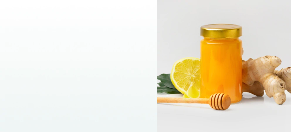 A jar of honey with lemon, ginger, and a honey dipper, representing natural remedies and supplements for immune system support.