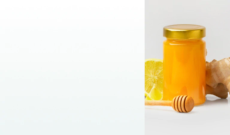 A jar of honey with lemon, ginger, and a honey dipper, representing natural remedies and supplements for immune system support.