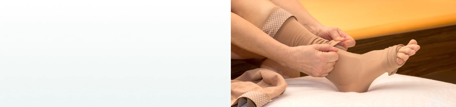 A person putting on beige compression socks, a common support tool used alongside supplements for lymph system health.
