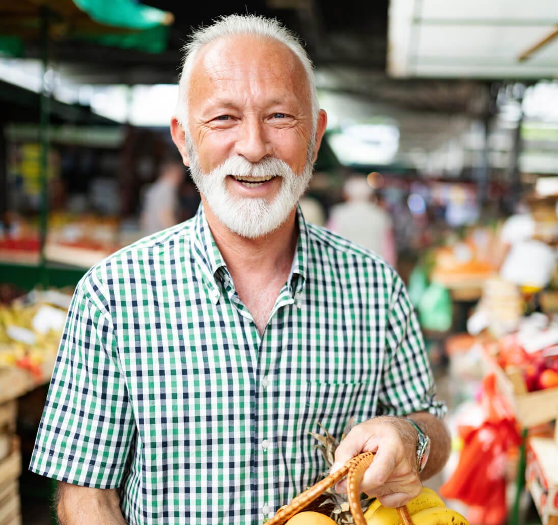 Healthy senior holding a basket