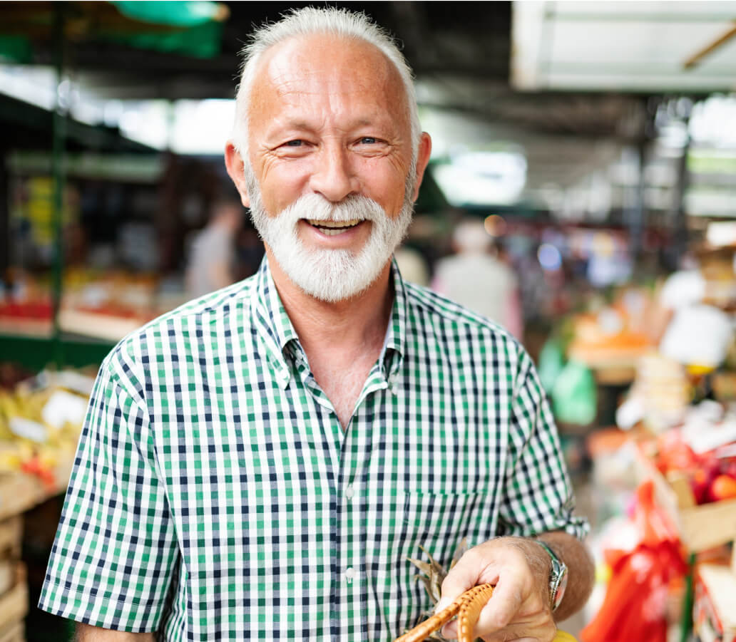 Healthy senior holding a basket