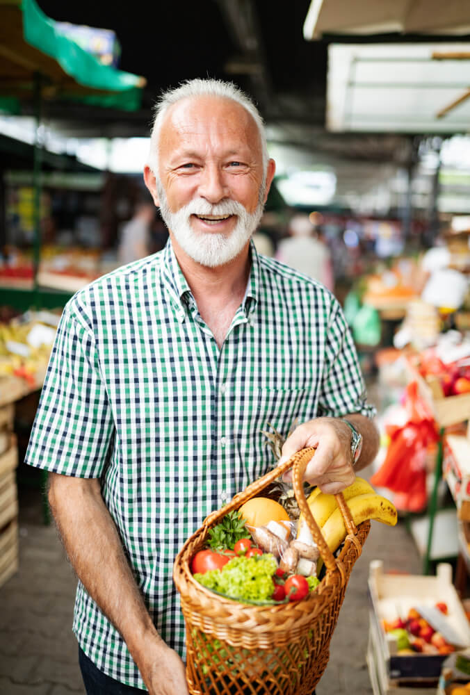Healthy senior holding a basket